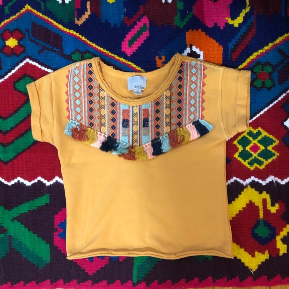 Anthopologie Yellow tee with tassels